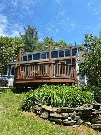 70 Cutler Road Holden, MA 01522 - Photo 26 of 28 a wooden fence with some trees in the background