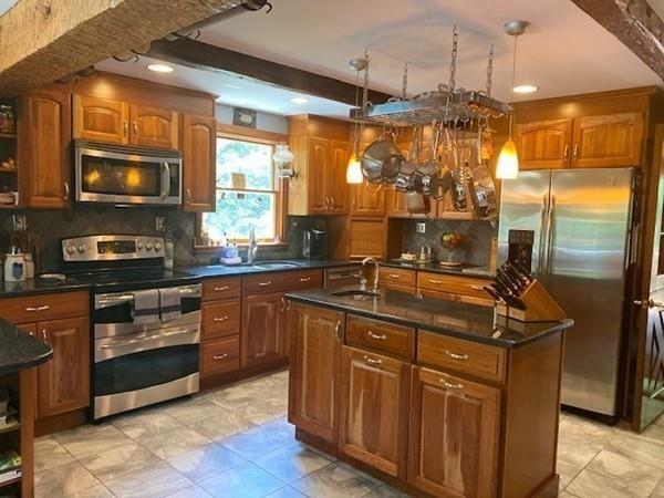 70 Cutler Road Holden, MA 01522 - Photo 8 of 28 a kitchen with granite countertop a sink stove and refrigerator