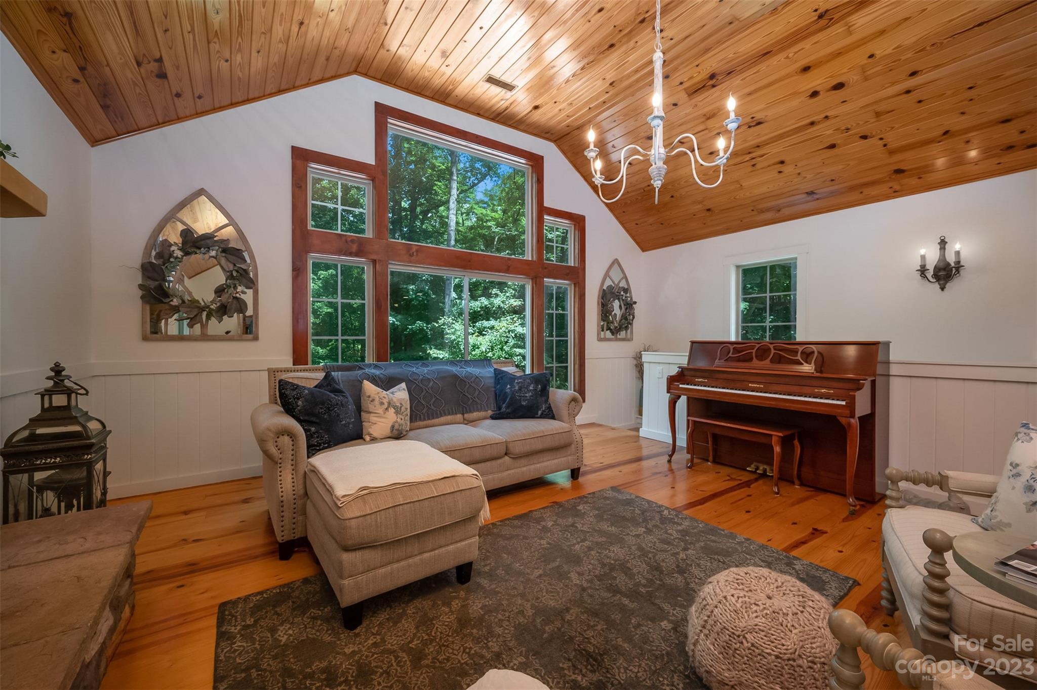 280 Cherokee Circle Tryon, NC 28782 - Photo 5 of 38 a living room with furniture a piano and a large window