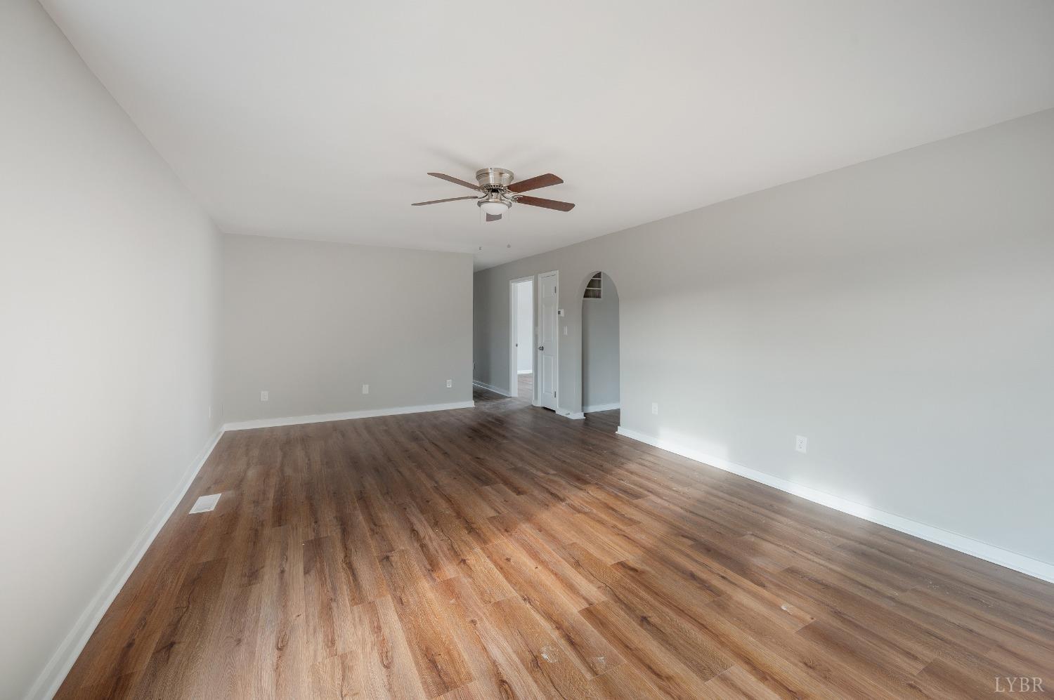 1784 Lukin Road Pamplin, VA 23958 - Photo 16 of 31 wooden floor in an empty room with a window