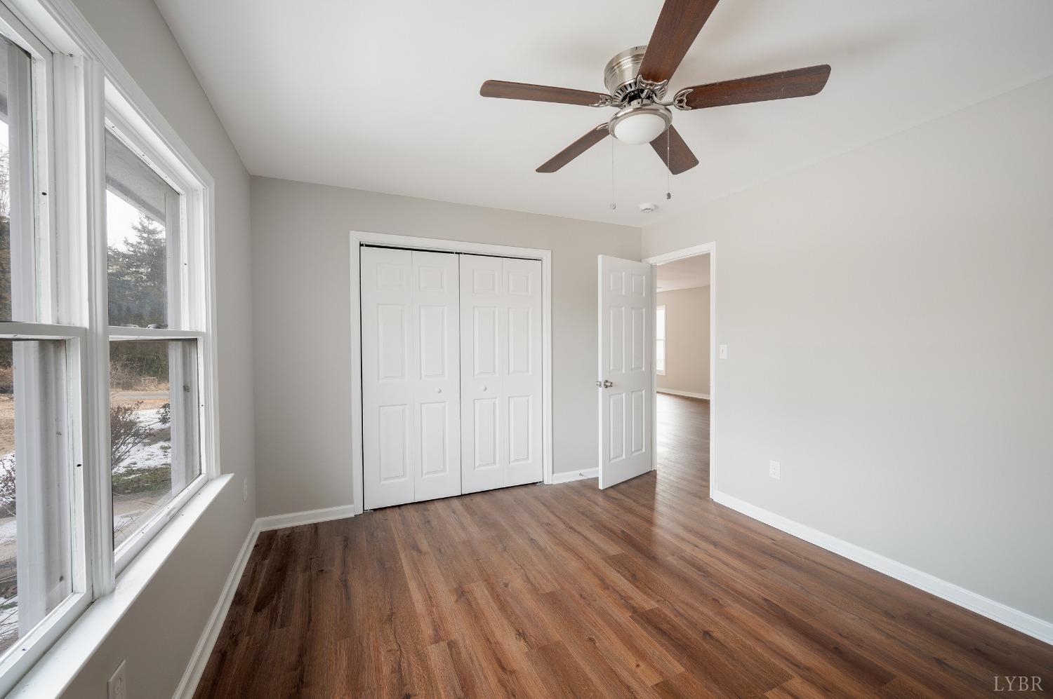 1784 Lukin Road Pamplin, VA 23958 - Photo 25 of 31 a view of empty room with wooden floor and fan