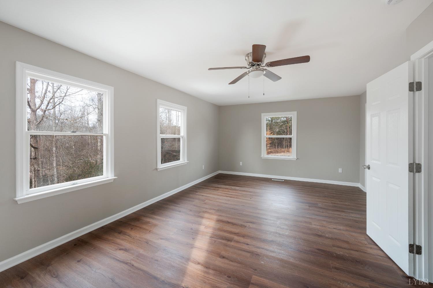 1784 Lukin Road Pamplin, VA 23958 - Photo 27 of 31 a view of an empty room with wooden floor and window