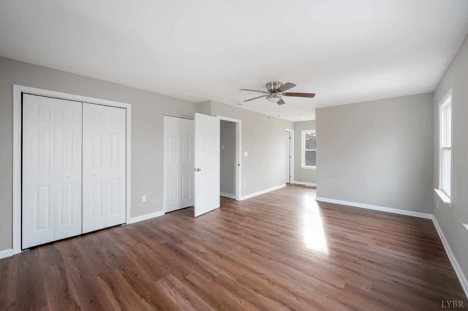 1784 Lukin Road Pamplin, VA 23958 - Photo 28 of 31 a view of an empty room with wooden floor and a window