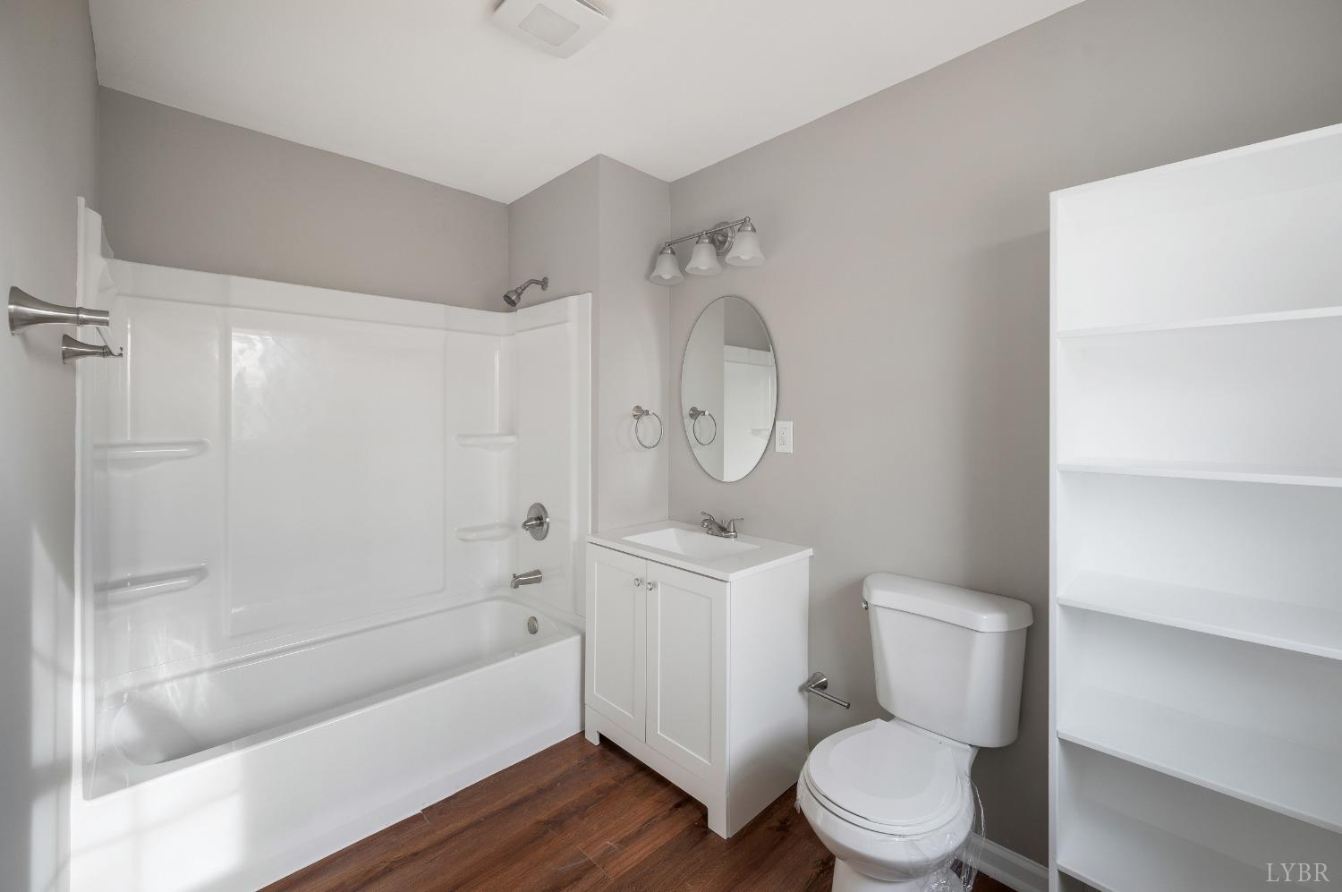 1784 Lukin Road Pamplin, VA 23958 - Photo 29 of 31 a bathroom with a toilet a sink and a bathtub