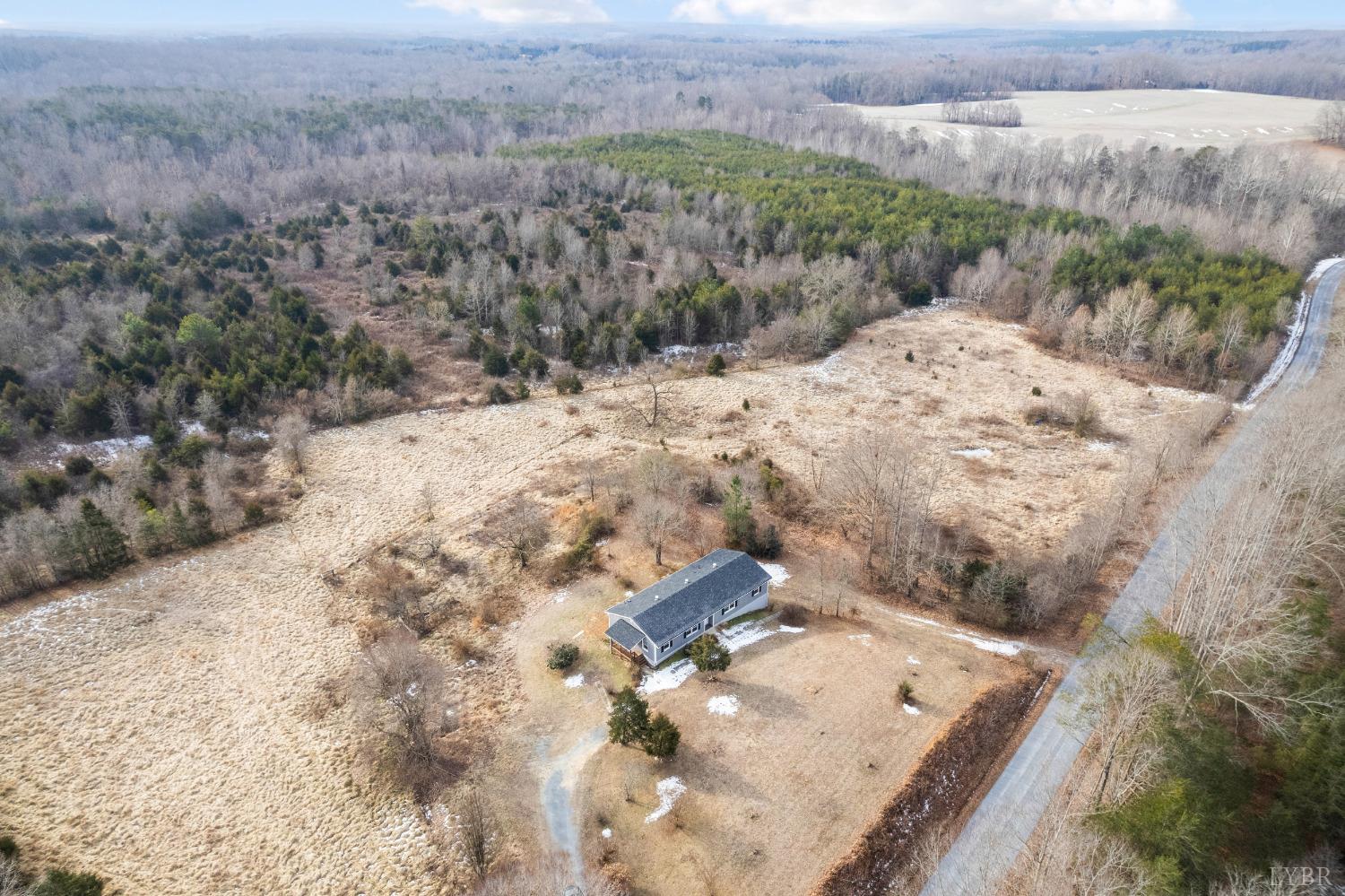 1784 Lukin Road Pamplin, VA 23958 - Photo 3 of 31 a view of a backyard of snow