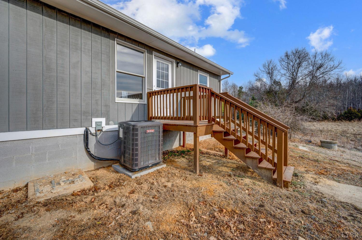 1784 Lukin Road Pamplin, VA 23958 - Photo 8 of 31 a view of a chair and table in the backyard