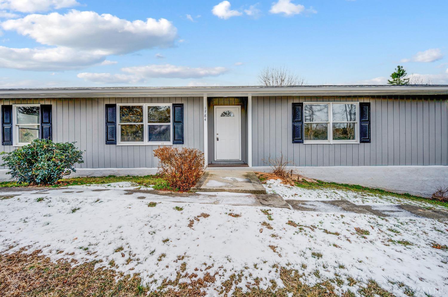 1784 Lukin Road Pamplin, VA 23958 - Photo 10 of 31 a front view of a house with a yard