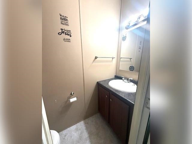 3251 E Road, Unit 11 Clifton, CO 81520 - Photo 9 of 15 a bathroom with a sink and toilet