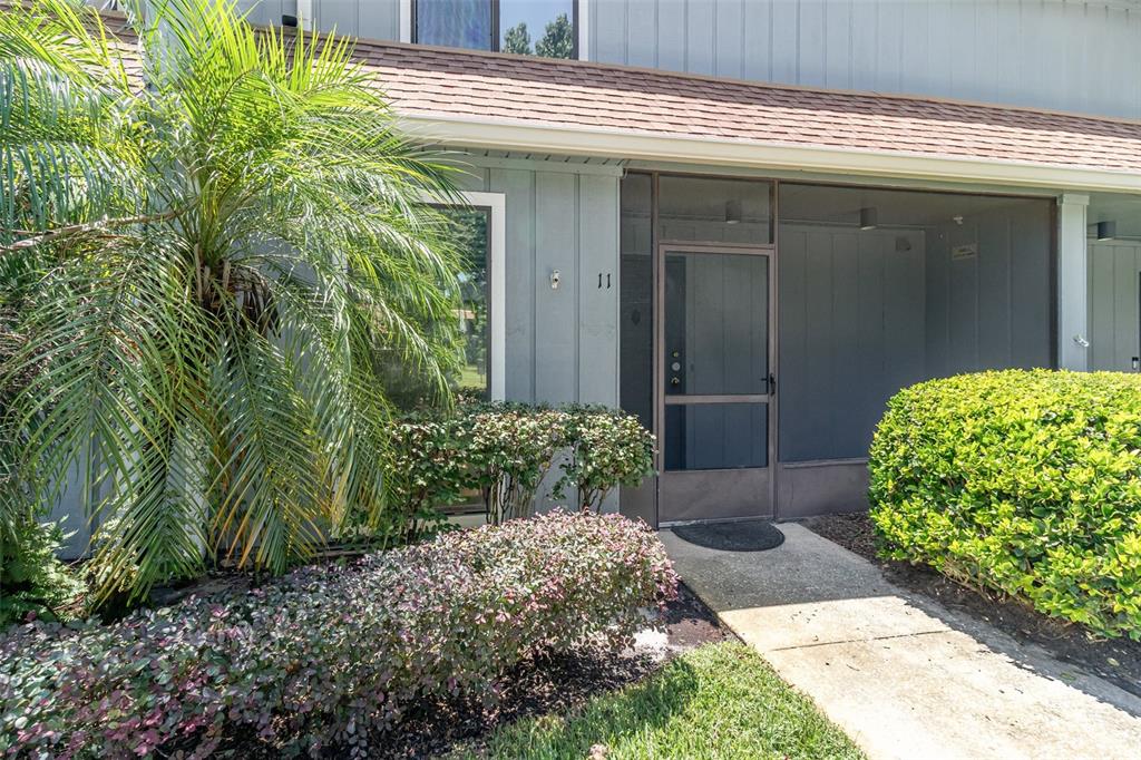 40 Moree Loop, Unit 11 Winter Springs, FL 32708 - Photo 1 of 1 a front view of a house with garden