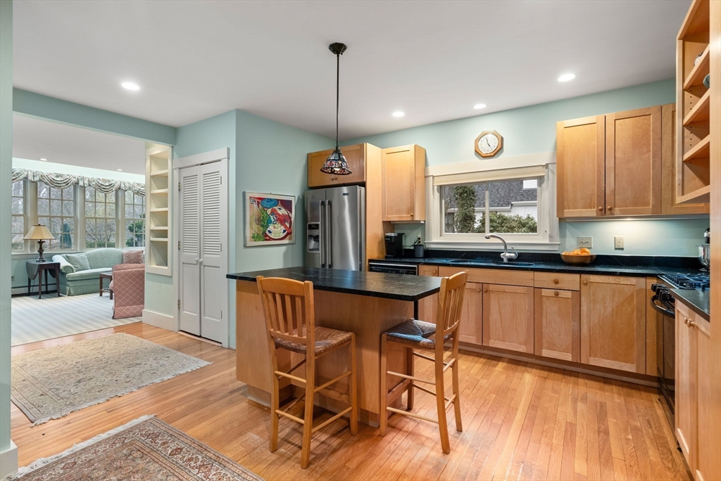 647 Boston Post Road Weston, MA 02493 - Photo 11 of 30 a kitchen with stainless steel appliances granite countertop a sink and a refrigerator