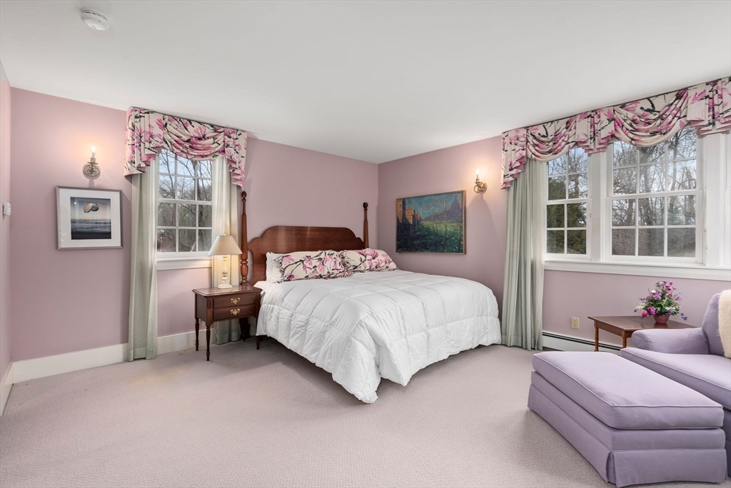 647 Boston Post Road Weston, MA 02493 - Photo 17 of 30 a bedroom with a large bed and a window