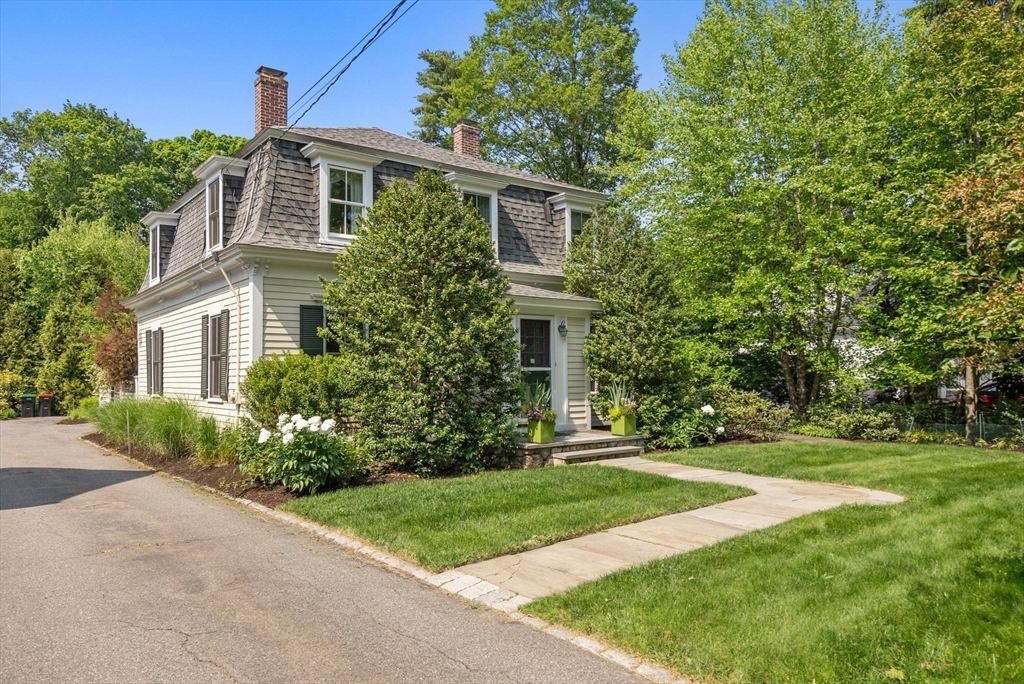 647 Boston Post Road Weston, MA 02493 - Photo 30 of 30 a front view of a house with a yard