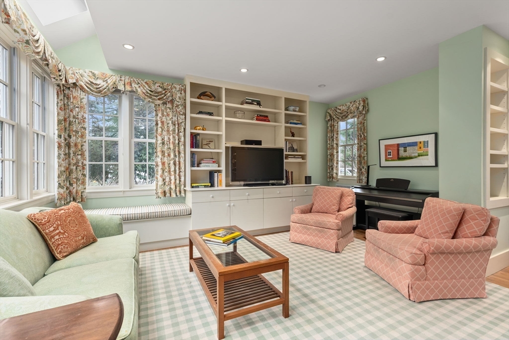 647 Boston Post Road Weston, MA 02493 - Photo 5 of 30 a living room with furniture and a flat screen tv