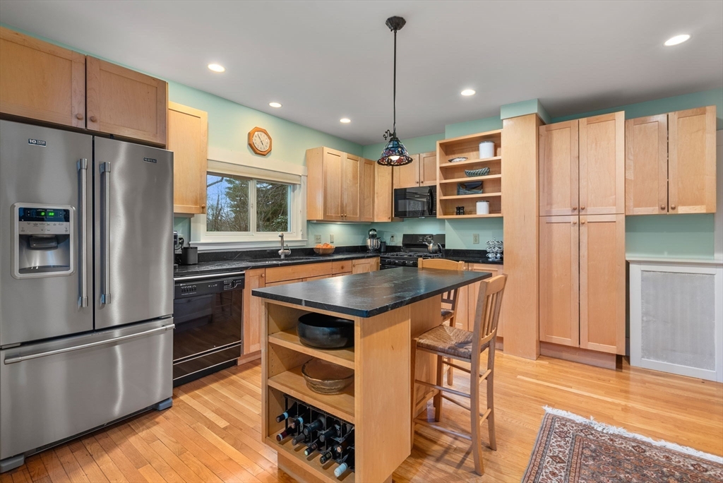 647 Boston Post Road Weston, MA 02493 - Photo 8 of 30 a kitchen with stainless steel appliances granite countertop a refrigerator a stove a sink and a refrigerator