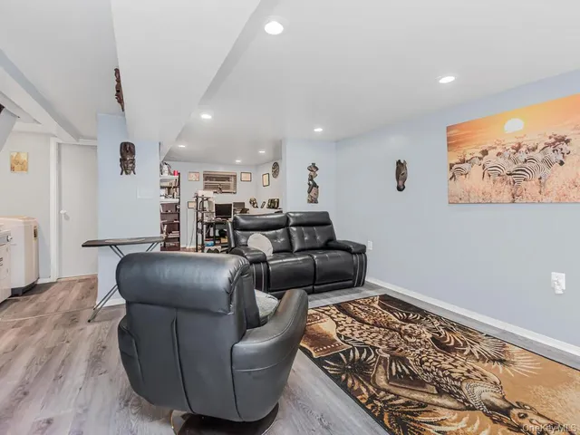 a living room with furniture and a rug