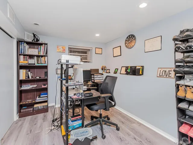 a view of a workspace with furniture and toys