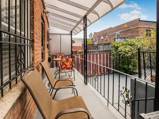 a view of a balcony with furniture