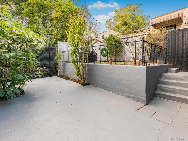 a view of a house with basketball court