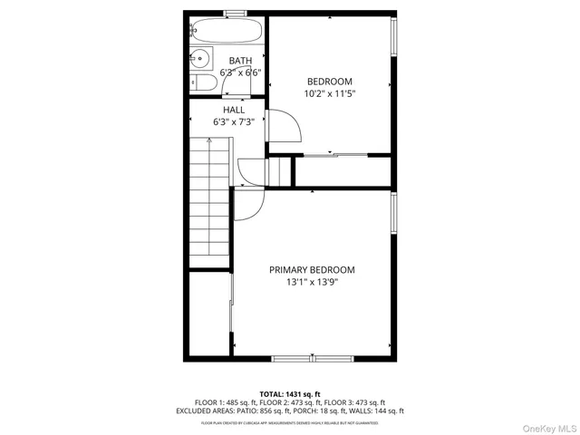 a picture of a bench in front of a wall