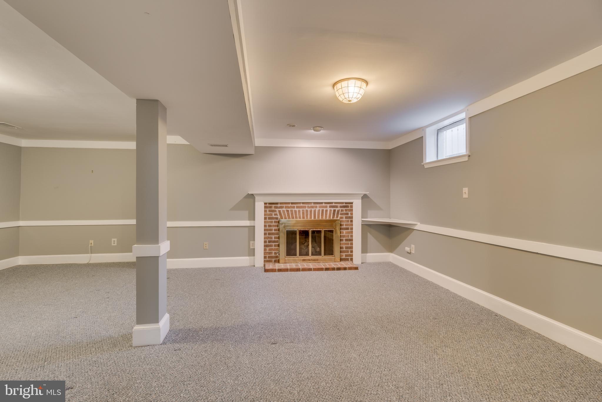 2069 Cobblestone Lane Reston, VA 20191 - Photo 29 of 35 a view of an empty room with a fireplace and a window