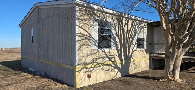 a view of a back yard of the house