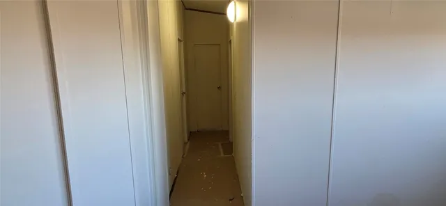 a bathroom with a toilet and a mirror