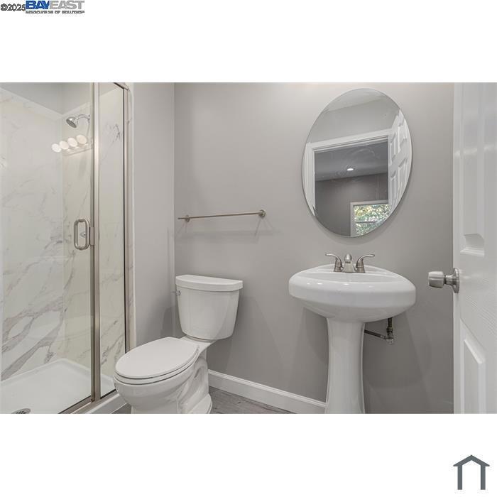 193 West MacArthur Boulevard Oakland, CA 94611 - Photo 8 of 9 a bathroom with a sink toilet and a mirror