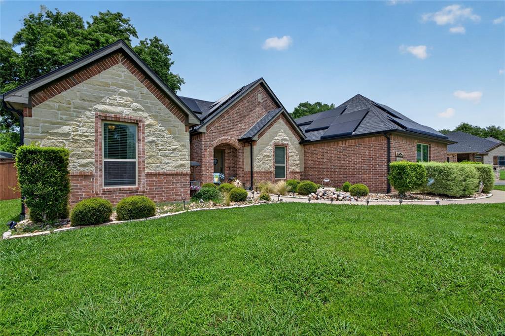 701 West Lamberth Road Sherman, TX 75092 - Photo 5 of 37 Traditional-style home featuring a brick and stone facade