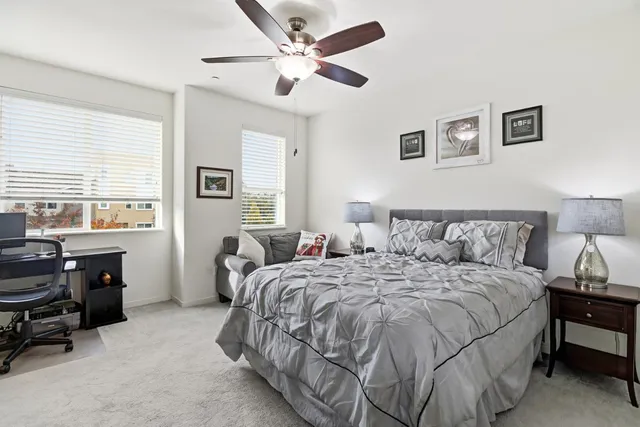 a bedroom with bed and a window