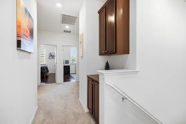 a view of a kitchen from the hallway