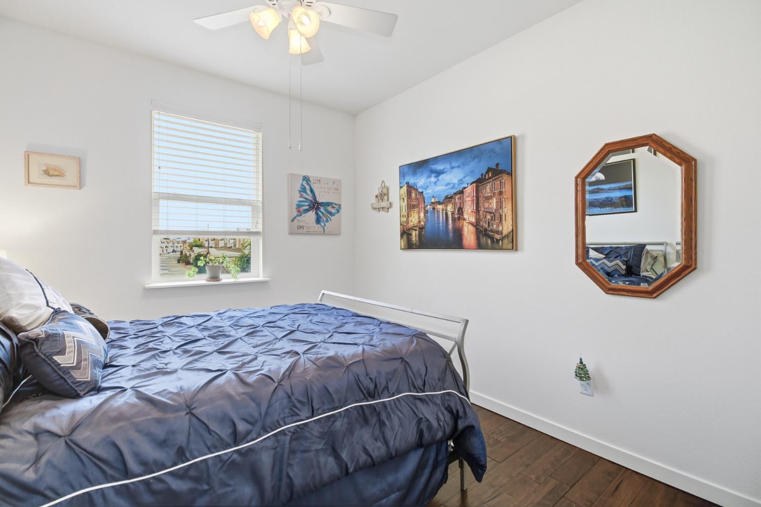 3215 Bridgeway Drive Rancho Cordova, CA 95670 - Photo 25 of 32 a bedroom with a bed and a painting on the wall