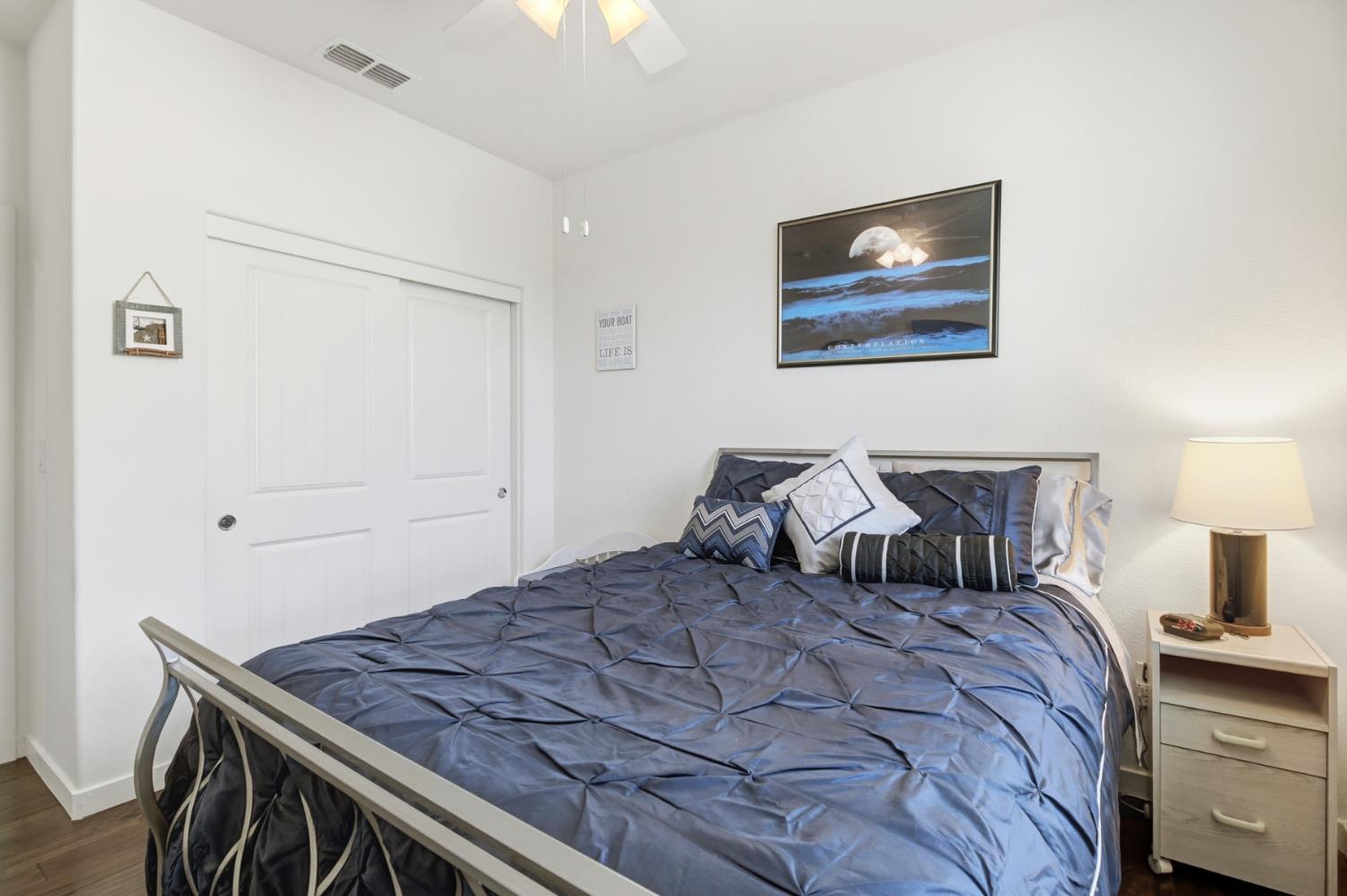 3215 Bridgeway Drive Rancho Cordova, CA 95670 - Photo 26 of 32 a bedroom with a bed and lamp