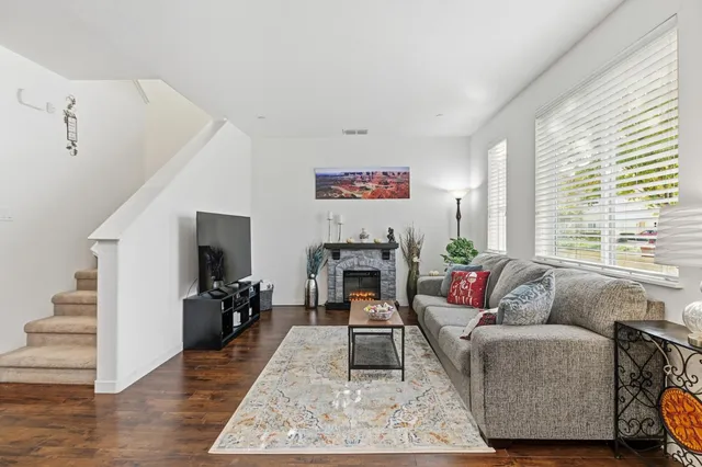 a living room with furniture or couch and a fireplace