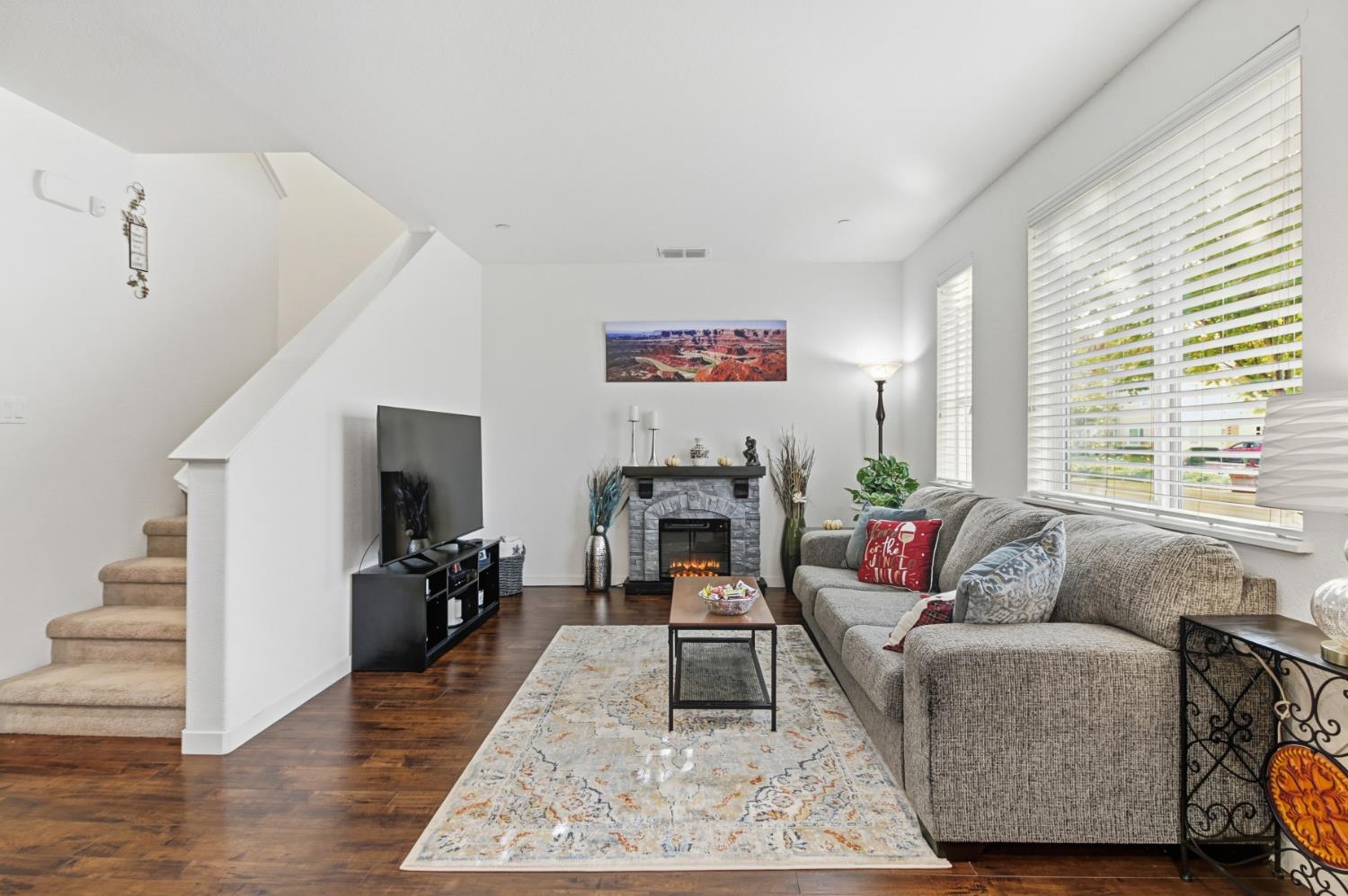 3215 Bridgeway Drive Rancho Cordova, CA 95670 - Photo 5 of 32 a living room with furniture or couch and a fireplace