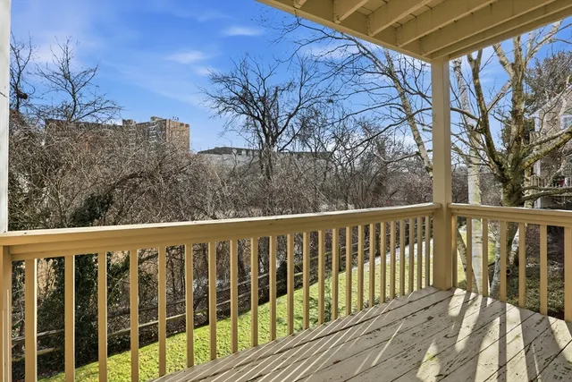 a view of a balcony with furniture