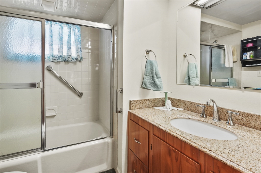 305 Whalom Road Lunenburg, MA 01462 - Photo 27 of 29 a bathroom with a granite countertop sink and a mirror