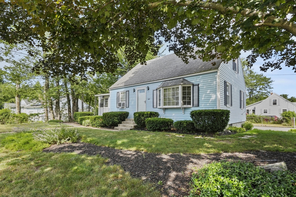 305 Whalom Road Lunenburg, MA 01462 - Photo 3 of 29 a front view of a house with a yard