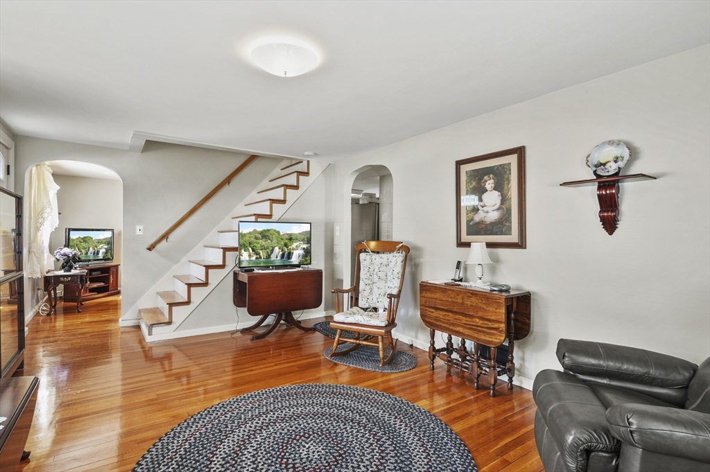 305 Whalom Road Lunenburg, MA 01462 - Photo 5 of 29 a living room with furniture and wooden floor