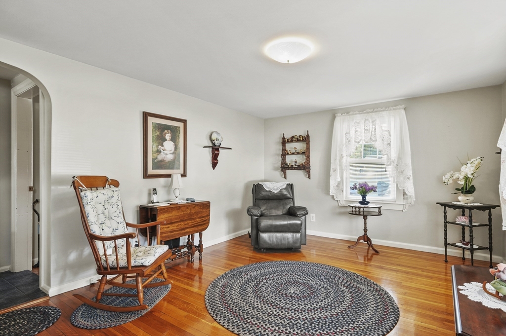 305 Whalom Road Lunenburg, MA 01462 - Photo 7 of 29 a living room with furniture and wooden floor