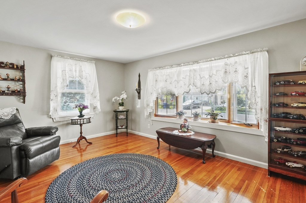 305 Whalom Road Lunenburg, MA 01462 - Photo 8 of 29 a living room with furniture and a window