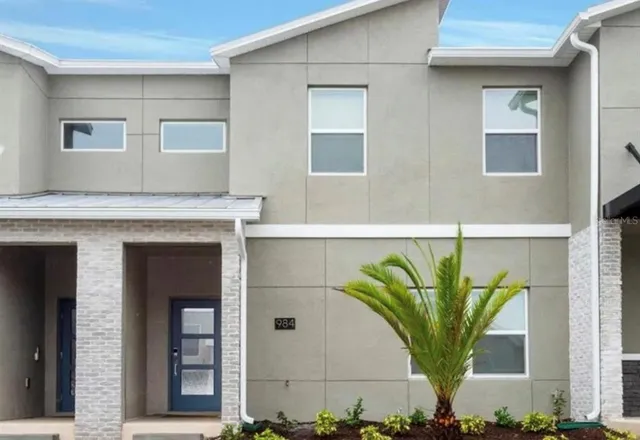 a view of a potted plant in front of a house