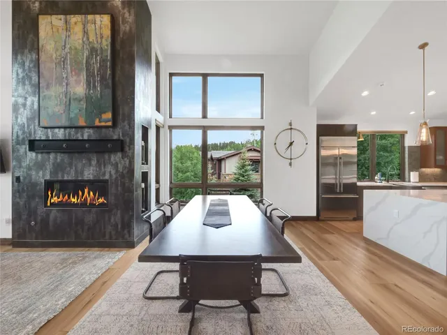 a dining room with furniture and a fireplace