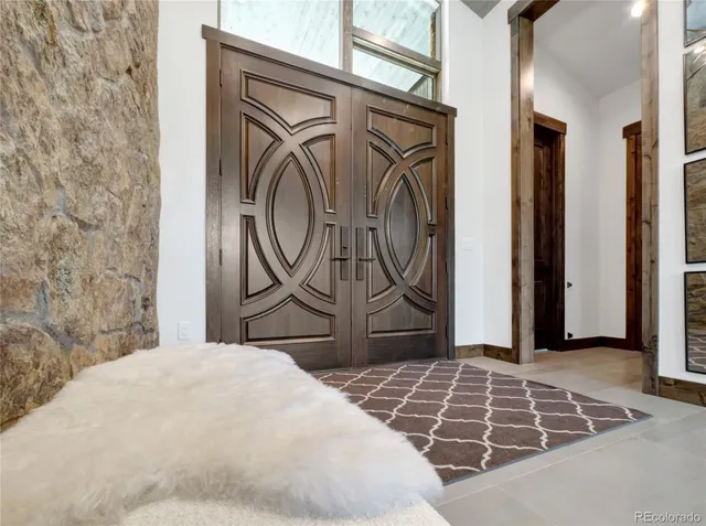 a bedroom with a bed and a mirror