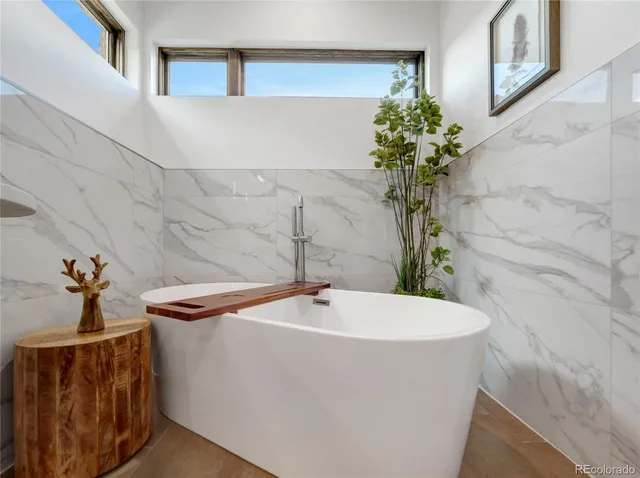 a white bath tub sitting in a bathroom