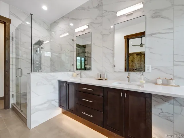 a bathroom with a double vanity sink mirror and double
