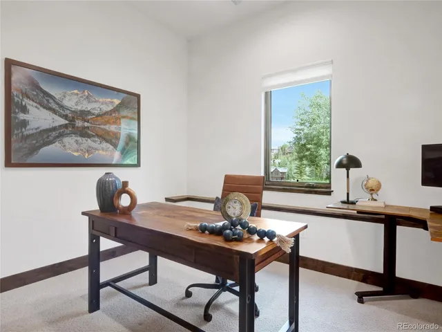 a view of a workspace with furniture