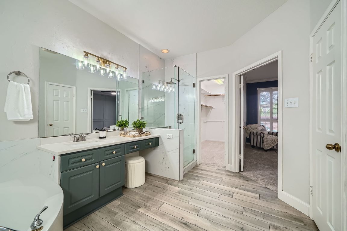 1237 Fall Creek Loop Cedar Park, TX 78613 - Photo 21 of 39 a bathroom with a double vanity sink and a mirror