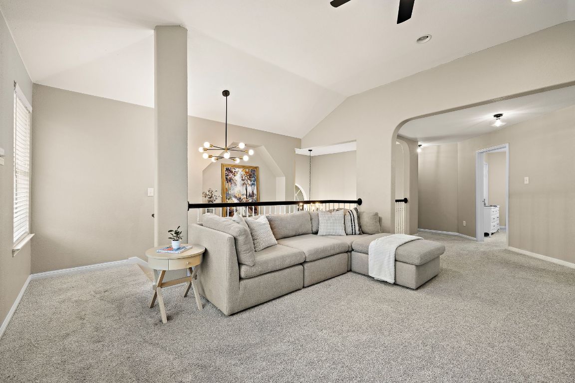 1237 Fall Creek Loop Cedar Park, TX 78613 - Photo 23 of 39 a living room with furniture and a chandelier