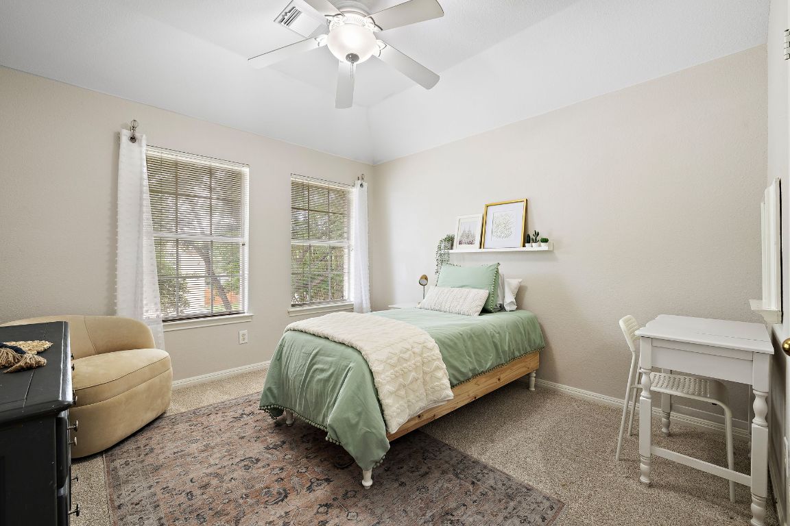 1237 Fall Creek Loop Cedar Park, TX 78613 - Photo 26 of 39 a bedroom with a bed wooden floor and window