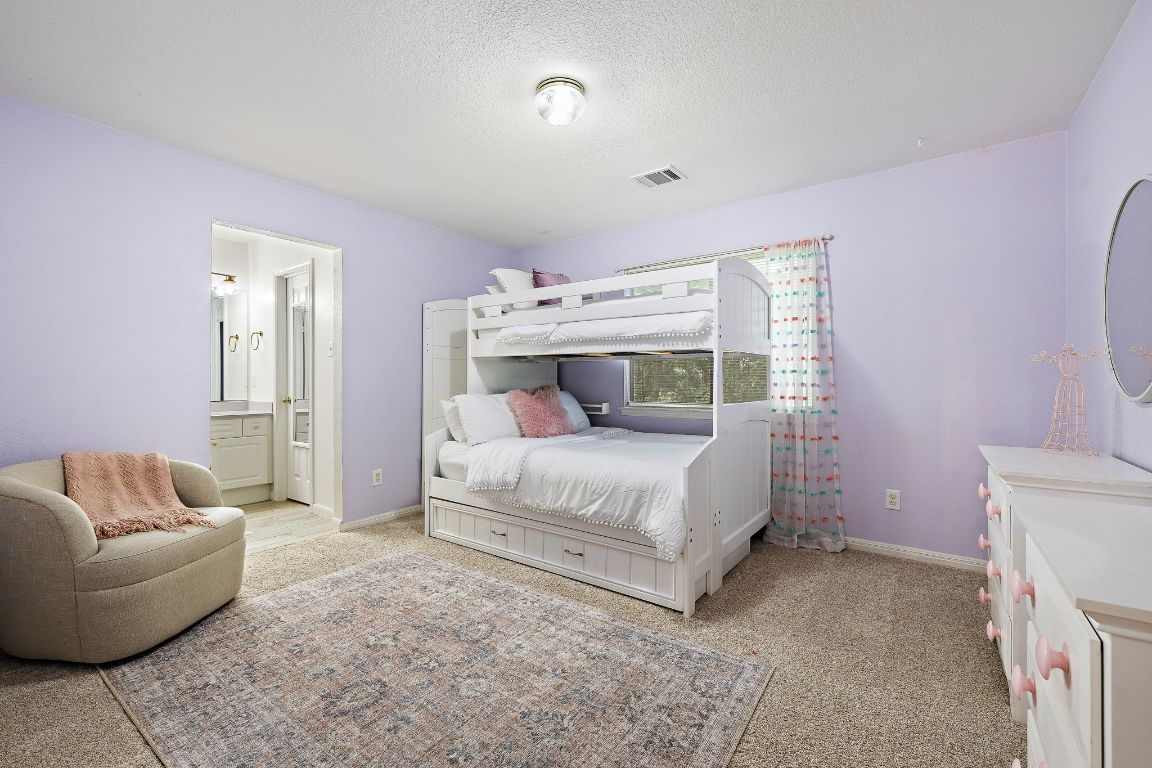 1237 Fall Creek Loop Cedar Park, TX 78613 - Photo 28 of 39 a bedroom with a bed and a couch